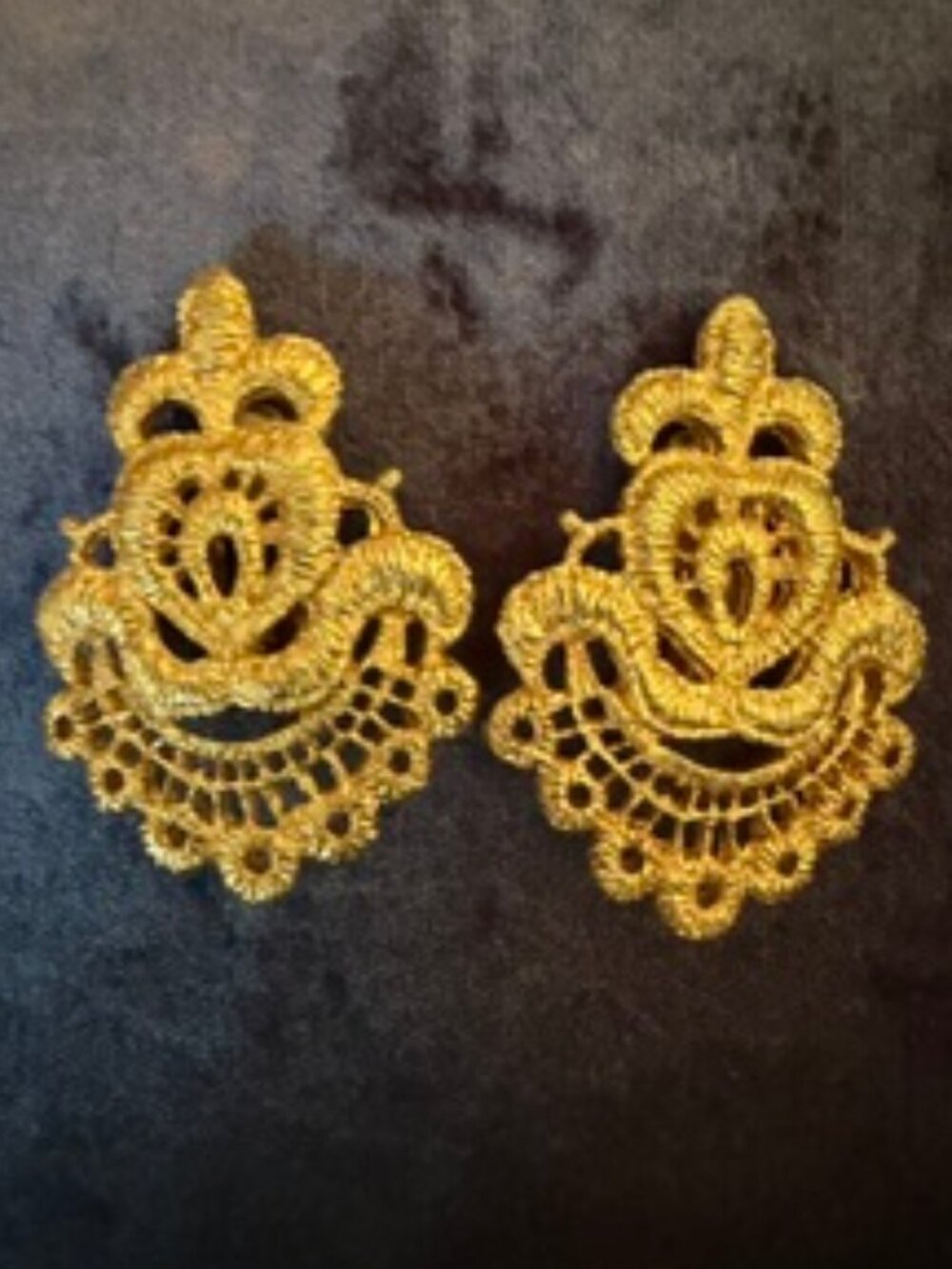 Carol Dauplaise gold tone crest clip on earrings